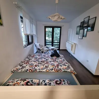 a bedroom with a bed and a table in it at 
