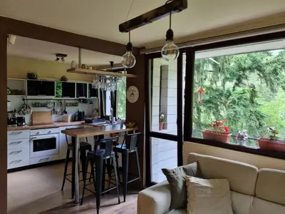 a kitchen with a couch and a table in a room at 