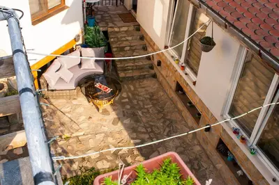 an overhead view of a balcony with a stone floor at Ози 1 Допълнителна къща за гости in Ovchartsi