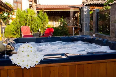 a jacuzzi tub filled with snow in a yard at Допълнителна къща за гости Ози 2 in Ovchartsi