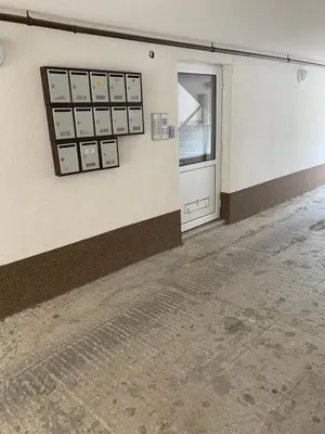 an empty room with a door in a building at Pazardzhik suite home in Pazardzhik