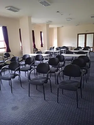 a room with tables and chairs in a room at Panorama Bansko in Bansko