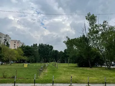 a park with a field with trees and grass at Apartment Mladost 2 - Free Parking in Sofia
