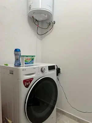 a microwave sitting on top of a washing machine at Apartment Mladost 2 - Free Parking in Sofia