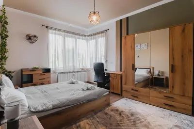 a bedroom with a bed and a desk and a chair at Eagles' Bridge - 1BD Flat with Desk by Flat Mаnager in Sofia