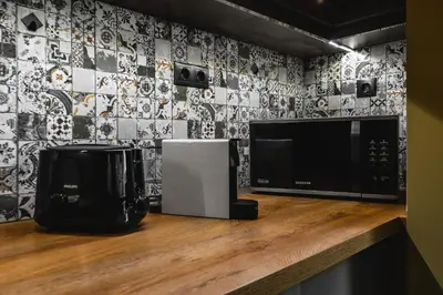 a kitchen counter with a microwave and a coffee maker at Eagles' Bridge - 1BD Flat with Desk by Flat Mаnager in Sofia