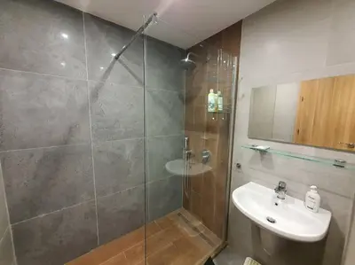 a bathroom with a shower and a sink at Large studio with view in Borovets Gardens in Borovets