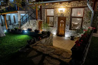 a front door of a house at night at Къща за приятели Недкови in Vasil Levski