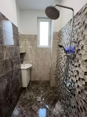 a bathroom with a shower and a sink at CityPulse Apt in Ideal Center w Working Space in Sofia