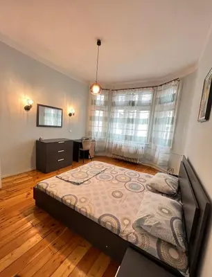 a bedroom with a large bed in a room at CityPulse Apt in Ideal Center w Working Space in Sofia