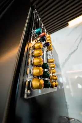 a row of wine bottles on a wine rack at Sofia Paradise View Apartment in Sofia