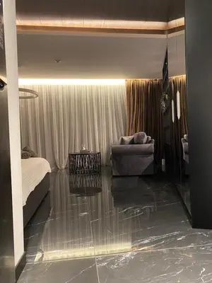 a bedroom with a bed and a couch in a room at Sofia Paradise Lux Apartment in Sofia