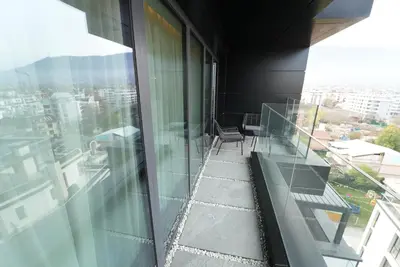 a balcony of a building with a view of a city at Sofia Paradise Lux Apartment in Sofia