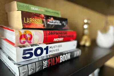 a stack of books sitting on top of a table at Contemporary Charm in Old Sofia in Sofia