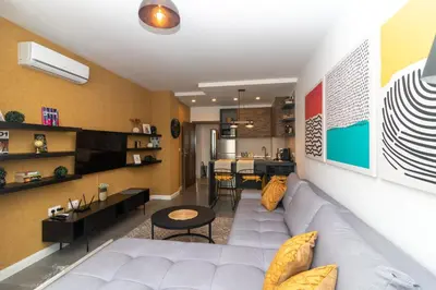 a living room with a couch and a table at Contemporary Charm in Old Sofia in Sofia