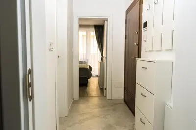 a hallway leading to a living room with a kitchen at COOP Apartments, Sofia - Free Parking in Sofia