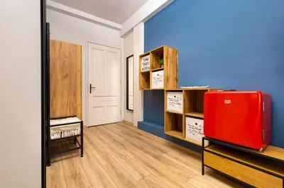 a room with a red suitcase and a mirror at Kapana Guest House on Central Pedestrian street with Parking included in Plovdiv