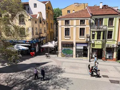 a group of people walking on a city street at 4 Rooms in Plovdiv