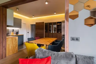 a kitchen and dining room with a table and chairs at The Honeycomb Hideaway by Flat Mаnager in Sofia