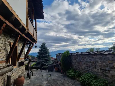 a view from the outside of a building with a tree at Leshten Valentin's House in Leshten
