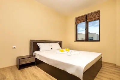 a bedroom with a large bed with a tray of fruit on it at South Plovdiv - 2BD Flat with Balcony by Flat Mаnager in Plovdiv