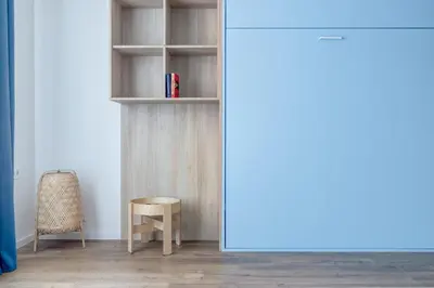 a room with a book shelf and a chair at New Studio - 300m Subway - 10 Mins City Centre in Sofia
