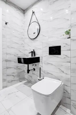 a white bathroom with a sink and a toilet at New Studio - 300m Subway - 10 Mins City Centre in Sofia