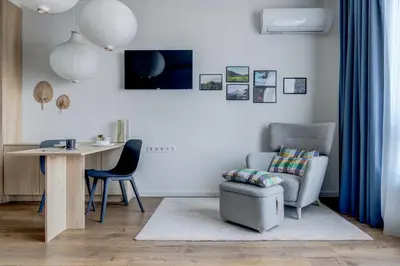 a living room with a chair and a desk at New Studio - 300m Subway - 10 Mins City Centre in Sofia