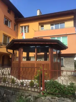 a building with a gazebo in front of it at Белевската къща с беседка Belevska House with gazebo in Smolyan