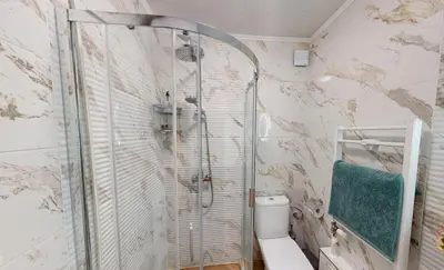 a bathroom with a shower and a toilet at Апартамент в топ център София 5 Corners in Sofia