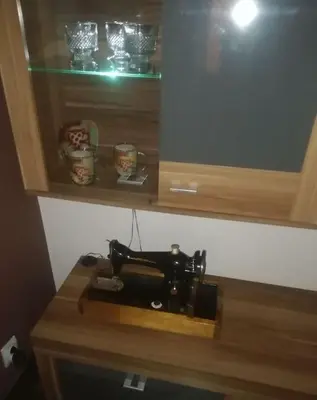 a sewing machine sitting on top of a wooden counter at Sofia Palms: Modern apartment with a large terrace in Sofia