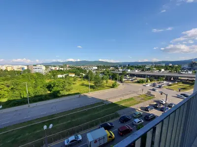 a view of a parking lot with cars parked at INTER EXPO APARTMENT in Sofia