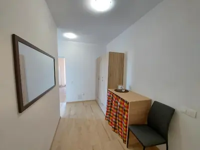 a room with a desk and a chair and a mirror at INTER EXPO APARTMENT in Sofia