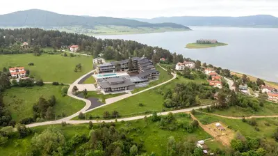an aerial view of a house on a hill next to a lake at Grande Vista Resort & Spa in Tsigov Chark