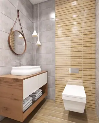 a bathroom with a sink and a toilet and a mirror at 2 BED APARTMENT IN BANSKO RESORT in Bansko