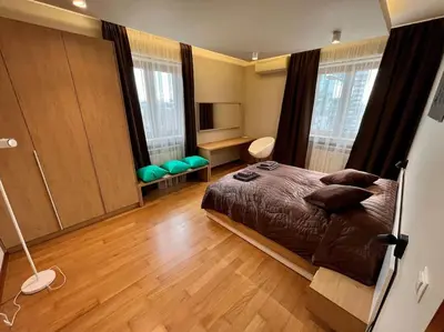 a bedroom with a bed and a wooden floor at LOCATION ! LOCATION ! LOCATION ! City Garden View Oak apartment in Sofia