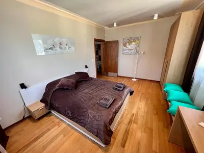 a bedroom with a large bed in a room at LOCATION ! LOCATION ! LOCATION ! City Garden View Oak apartment in Sofia