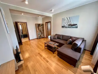 a living room with a couch and a table at LOCATION ! LOCATION ! LOCATION ! City Garden View Oak apartment in Sofia