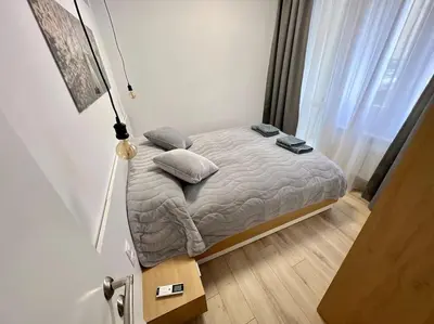 a small bed in a room with a window at LOCATION ! Sofia Opera Apartment next to ALEXANDER NEVSKY CATHEDRAL in Sofia