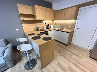 a small kitchen with a counter and a counter top at LOCATION ! Sofia Opera Apartment next to ALEXANDER NEVSKY CATHEDRAL in Sofia