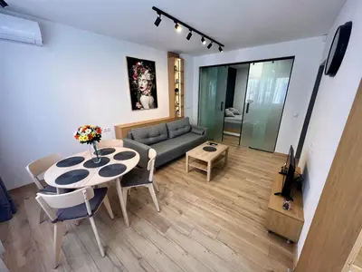a living room with a couch and a table at LOCATION ! Sofia Opera View Apartment next to ALEXANDER NEVSKY CATHEDRAL in Sofia