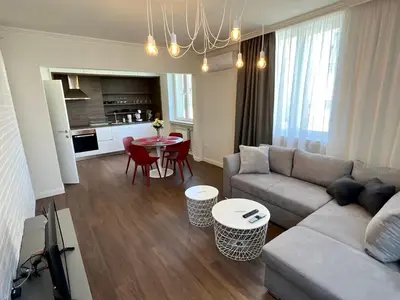 a living room with a couch and a table at LOCATION ! LOCATION ! LOCATION ! City Garden View Apartment in Sofia