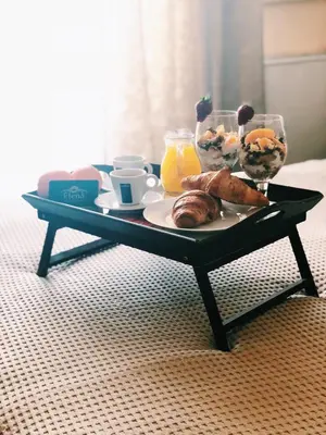 a coffee table with a tray of food on it at Elena Hotel in Petrich