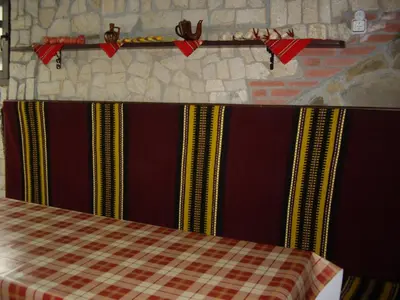 a room with a table with red bows on it at Guest House Rusalka in Shipkovo