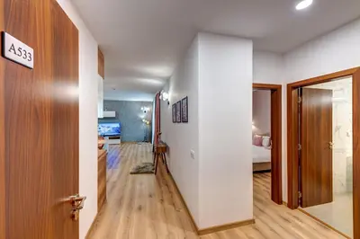 a hallway with a door leading to a bedroom at Secret Lake 533 at Oak Residence in Smolyan