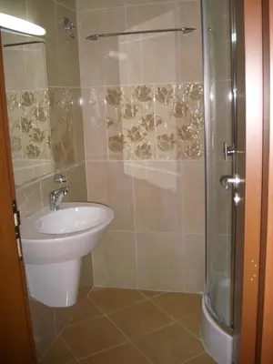 a bathroom with a shower and a toilet and a sink at Apartments in Relax Complex Fantasy in Hisarya
