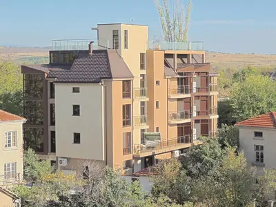 an apartment building in the middle of a city at Apartments in Relax Complex Fantasy in Hisarya
