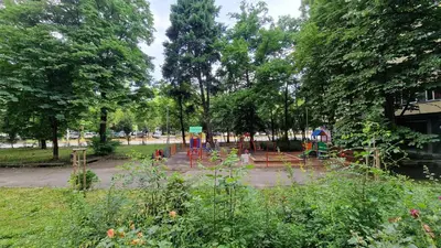 a park with a playground and tables and trees at Urban Comfort 1BR near South Park with Balcony in Sofia