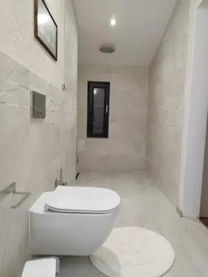 a bathroom with a white toilet in a room at Artistic loft with AMAZING VIEW in Plovdiv