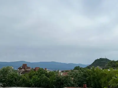 a view of a city with mountains in the background at Artistic loft with AMAZING VIEW in Plovdiv